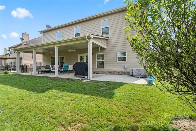 1011 Potomac Rd, Indian Trail, NC 28079 - back of property with a ceiling fan, a patio, a chimney, and an outdoor hangout area