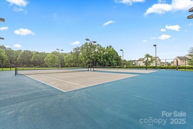 1011 Potomac Rd, Indian Trail, NC 28079 - view of tennis court featuring community basketball court