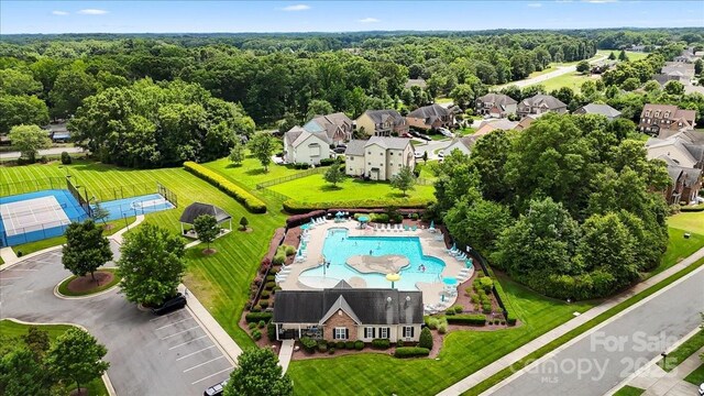 1011 Potomac Rd, Indian Trail, NC 28079 - aerial view of a pool area and a heavily wooded area