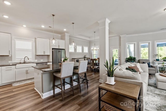 1260 Thomas Knapp Pkwy, Fort Mill, SC 29715 - kitchen with high end fridge, a sink, open floor plan, a healthy amount of sunlight, and wood finished floors