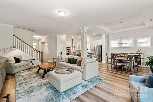 1260 Thomas Knapp Pkwy, Fort Mill, SC 29715 - living area featuring light wood-type flooring, baseboards, crown molding, and an inviting chandelier
