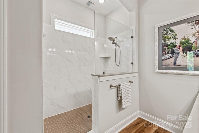 1260 Thomas Knapp Pkwy, Fort Mill, SC 29715 - bathroom with baseboards, walk in shower, wood finished floors, and visible vents