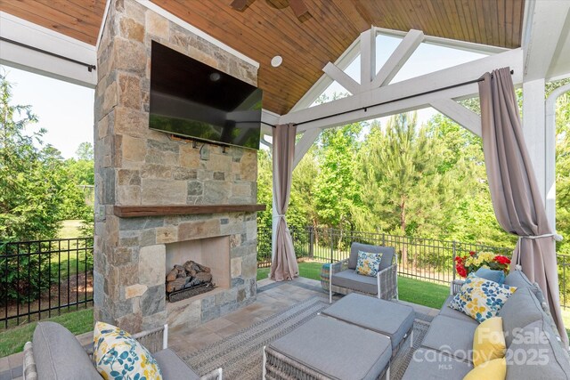 1260 Thomas Knapp Pkwy, Fort Mill, SC 29715 - view of patio with a gazebo, fence, a ceiling fan, and an outdoor living space with a fireplace