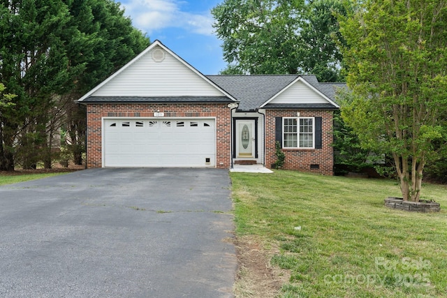 single story home featuring a garage, a front yard, driveway, and brick siding