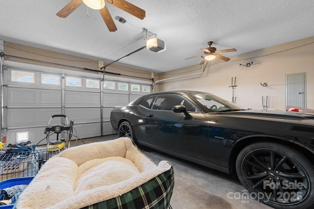 garage featuring ceiling fan, a garage door opener, and electric panel