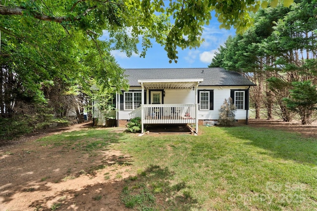 back of house featuring a shingled roof, a wooden deck, a yard, and crawl space