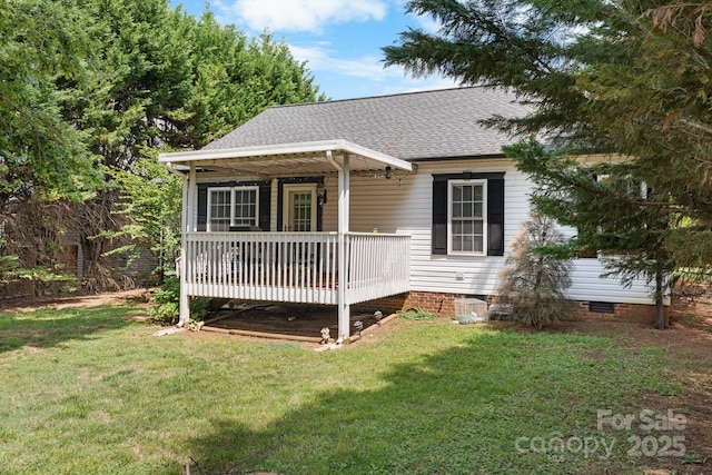 bungalow-style home featuring crawl space, a shingled roof, and a front yard