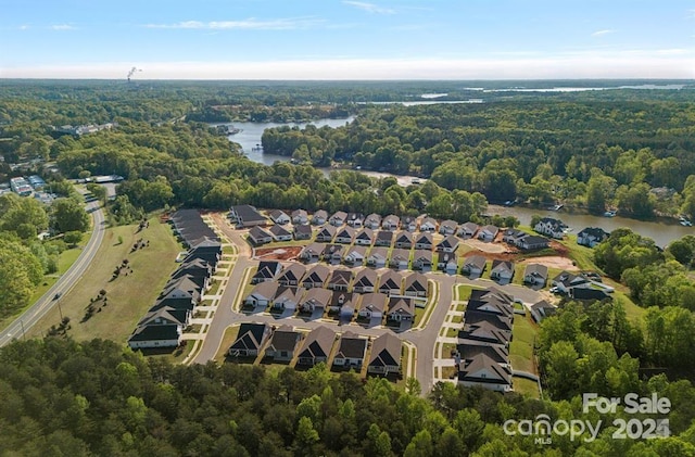 bird's eye view with a forest view, a residential view, and a water view