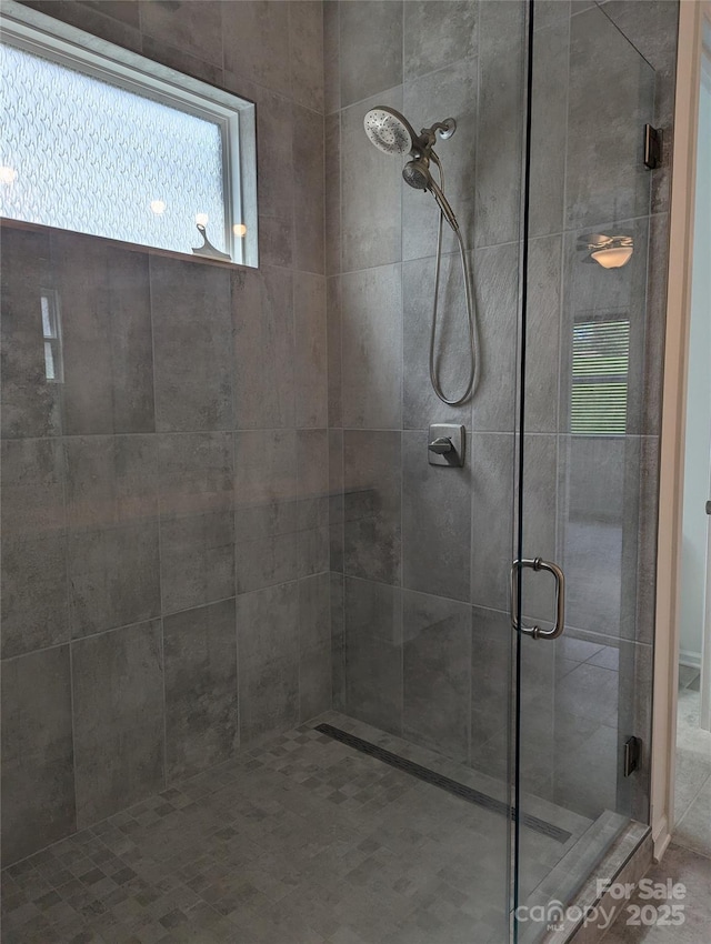 full bath featuring a shower stall