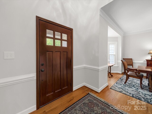 3133 English Sparrow Ln, Charlotte, NC 28210 - entrance foyer with baseboards, light wood-style floors, and crown molding