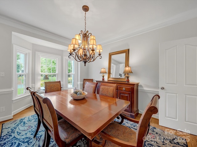 3133 English Sparrow Ln, Charlotte, NC 28210 - dining space featuring light wood-style floors, a chandelier, baseboards, and ornamental molding