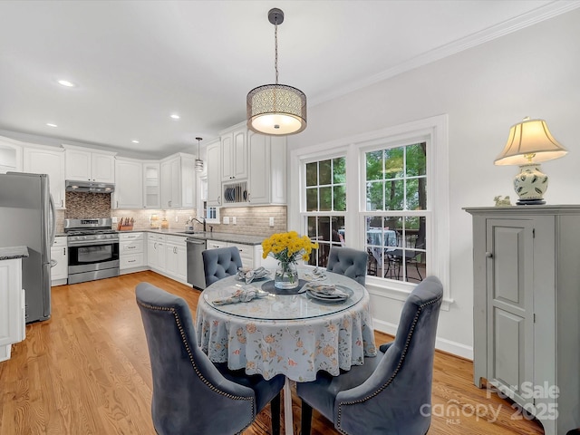 3133 English Sparrow Ln, Charlotte, NC 28210 - dining space with recessed lighting, light wood-style floors, and crown molding