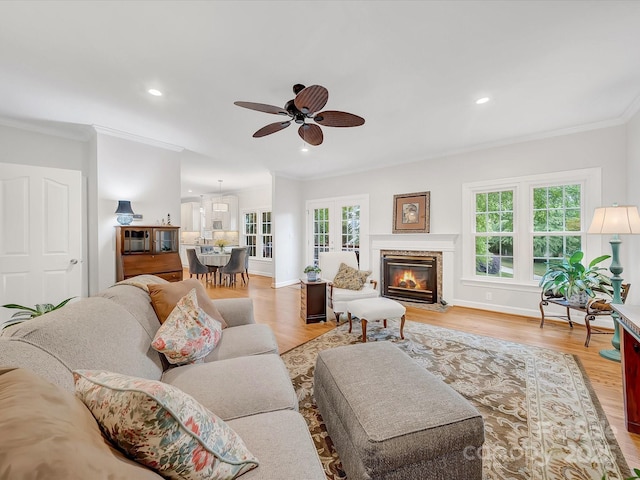 3133 English Sparrow Ln, Charlotte, NC 28210 - living area featuring ornamental molding, a healthy amount of sunlight, and light wood-type flooring