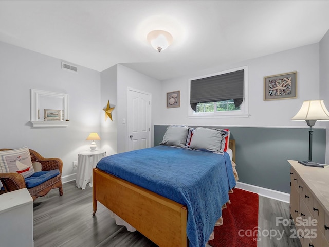 3133 English Sparrow Ln, Charlotte, NC 28210 - bedroom with baseboards, visible vents, and wood finished floors
