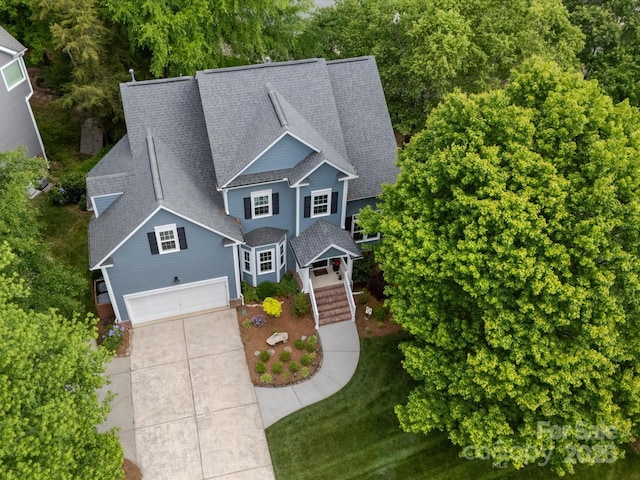 3133 English Sparrow Ln, Charlotte, NC 28210 - view of front of house featuring roof with shingles, concrete driveway, and an attached garage