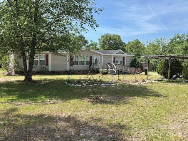 view of front of home featuring a front yard, a deck, and crawl space