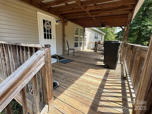 wooden deck featuring a ceiling fan
