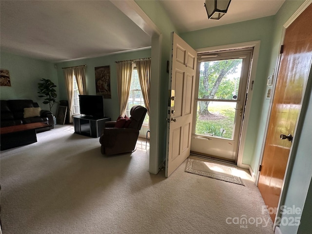 entryway featuring carpet floors