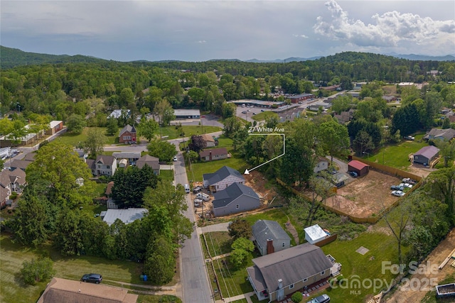 bird's eye view with a forest view and a residential view
