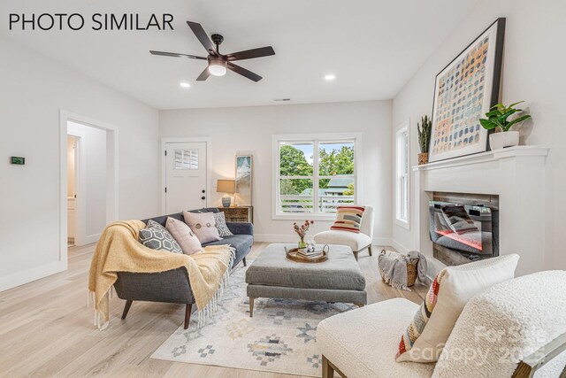 27 White Ave, Asheville, NC 28803 - living area featuring light wood-type flooring, a glass covered fireplace, a ceiling fan, baseboards, and recessed lighting