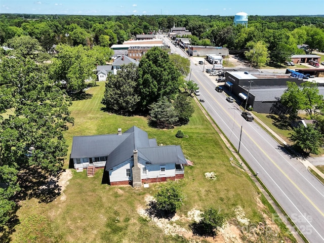 213 S Main St, Jefferson, SC 29718 - aerial view of property and surrounding area with a heavily wooded area