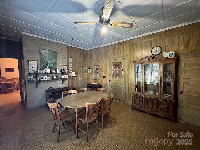 213 S Main St, Jefferson, SC 29718 - dining room featuring a ceiling fan and wood walls