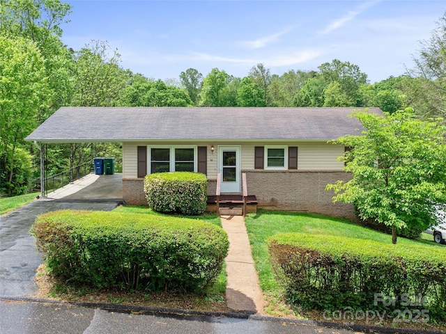 92 Church St, Weaverville, NC 28787 - ranch-style house with an attached carport, brick siding, and asphalt driveway