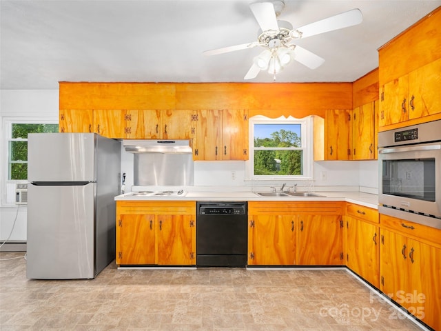92 Church St, Weaverville, NC 28787 - kitchen with appliances with stainless steel finishes, under cabinet range hood, a sink, light countertops, and a baseboard heating unit