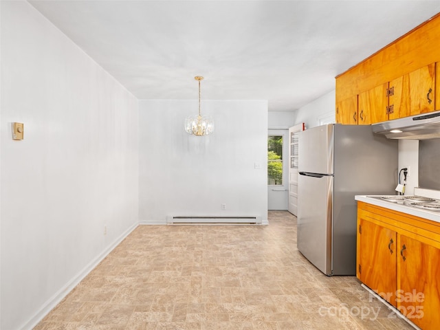 92 Church St, Weaverville, NC 28787 - kitchen with a baseboard radiator, light countertops, under cabinet range hood, a chandelier, and white electric stovetop