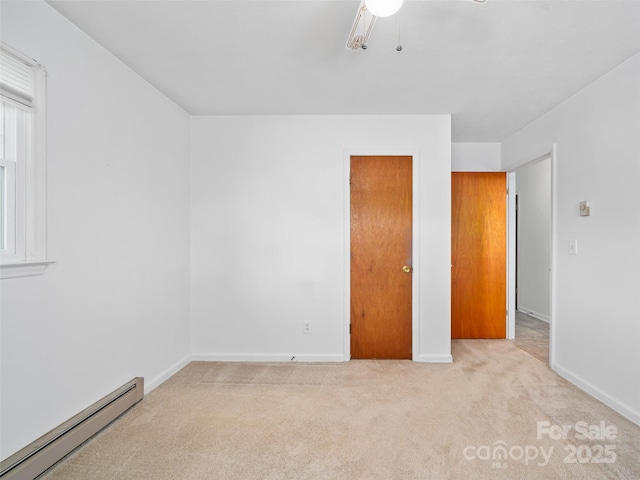 92 Church St, Weaverville, NC 28787 - unfurnished bedroom featuring a baseboard radiator, carpet floors, baseboards, and ceiling fan