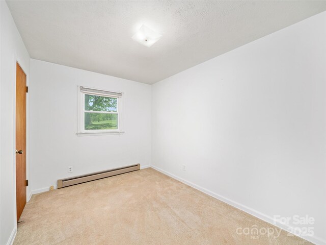 92 Church St, Weaverville, NC 28787 - carpeted spare room featuring baseboard heating and baseboards