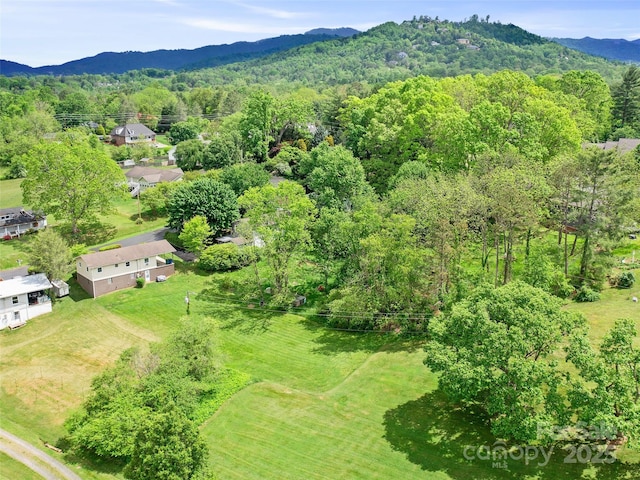 92 Church St, Weaverville, NC 28787 - aerial view of property's location featuring a mountain backdrop and a heavily wooded area