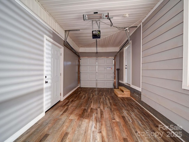 garage featuring baseboards and a garage door opener