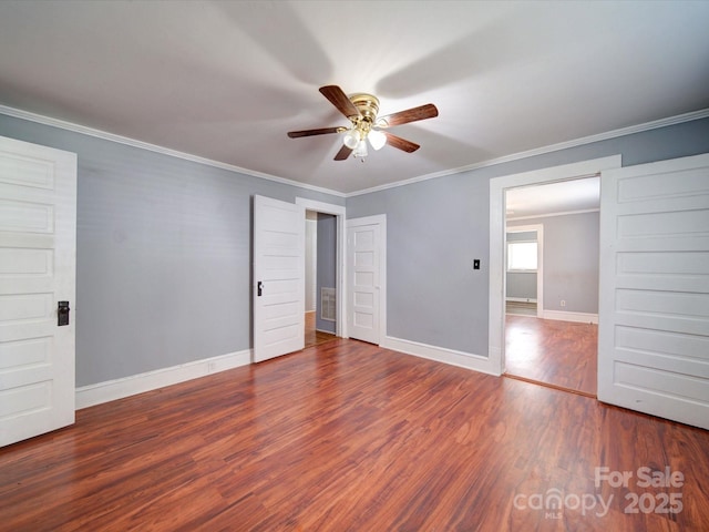 unfurnished bedroom with baseboards, ornamental molding, ceiling fan, and wood finished floors