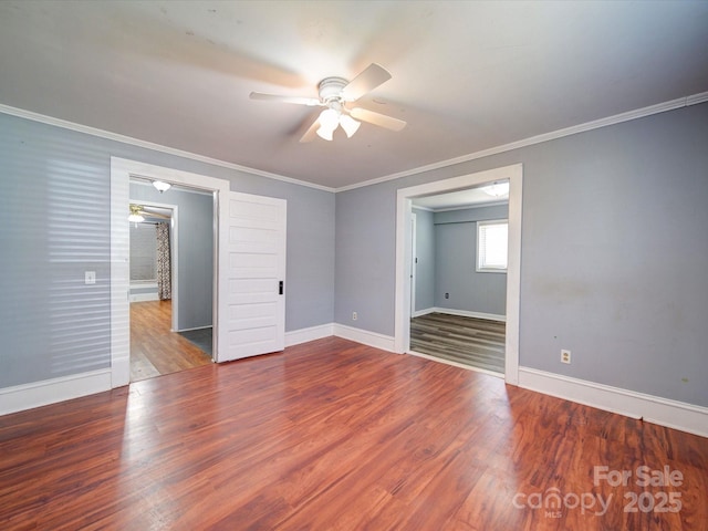 unfurnished bedroom featuring crown molding, baseboards, ceiling fan, and wood finished floors