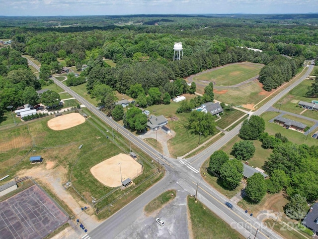 bird's eye view featuring a wooded view