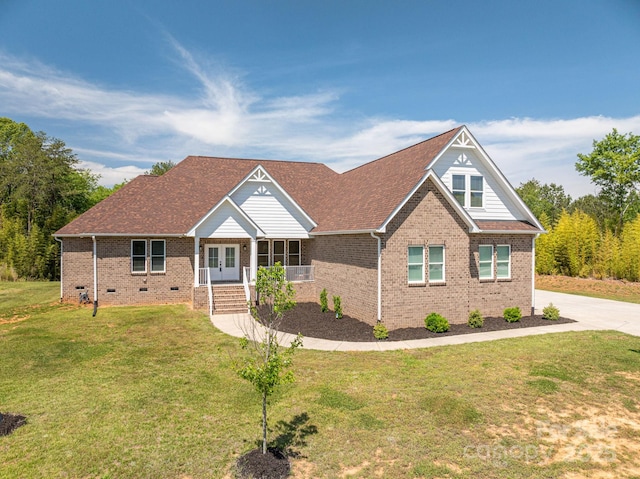 115 Woodward Way, Iron Station, NC 28080 - craftsman-style home featuring french doors, brick siding, a front lawn, and covered porch