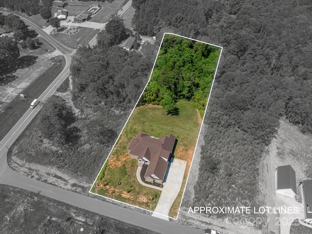 115 Woodward Way, Iron Station, NC 28080 - aerial view of property and surrounding area with property parcel outlined and a heavily wooded area