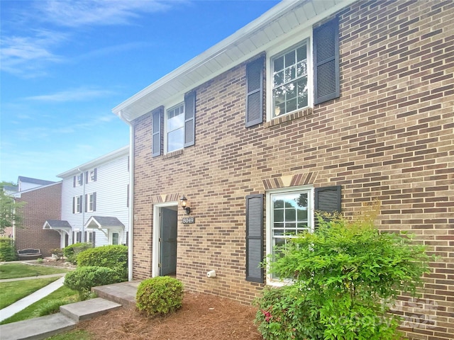 exterior space featuring brick siding