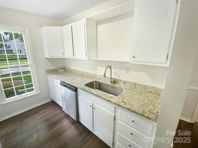 kitchen featuring dark wood-style flooring, light stone counters, a sink, and dishwasher