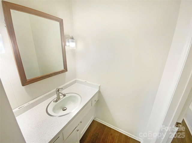 bathroom featuring vanity and wood finished floors
