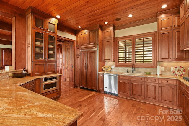 693 Thunderhill Trl, Blowing Rock, NC 28605 - kitchen with appliances with stainless steel finishes, a sink, wood ceiling, light wood finished floors, and light stone counters