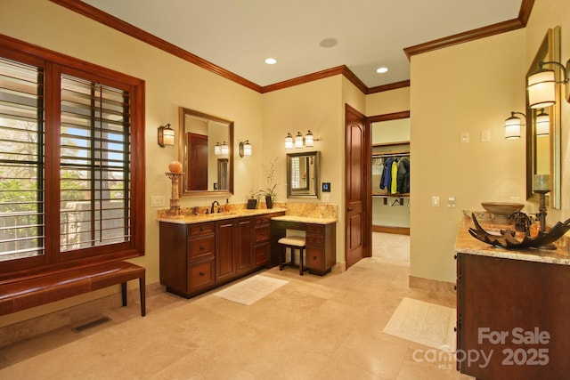 693 Thunderhill Trl, Blowing Rock, NC 28605 - bathroom featuring crown molding, two vanities, baseboards, recessed lighting, and a walk in closet