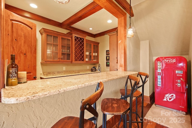 693 Thunderhill Trl, Blowing Rock, NC 28605 - kitchen with wood finished floors, glass insert cabinets, light stone counters, beam ceiling, and recessed lighting