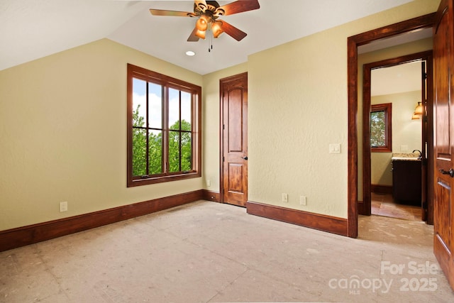 693 Thunderhill Trl, Blowing Rock, NC 28605 - unfurnished bedroom with baseboards, vaulted ceiling, and a ceiling fan
