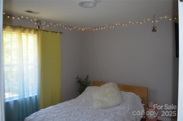 bedroom with visible vents