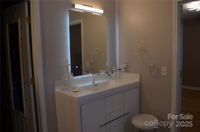 bathroom featuring vanity and wood finished floors