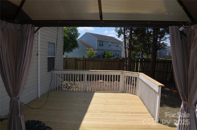 deck with a fenced backyard