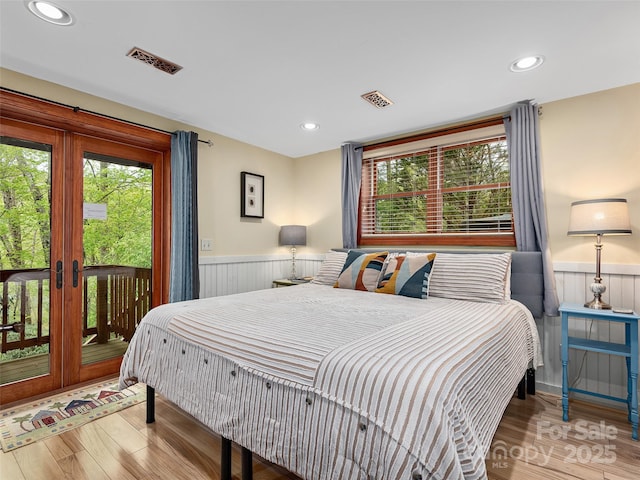 221 Holland Dr, Black Mountain, NC 28711 - bedroom with access to outside, wainscoting, and visible vents