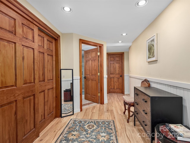 221 Holland Dr, Black Mountain, NC 28711 - hallway with recessed lighting, light wood-style flooring, and a wainscoted wall